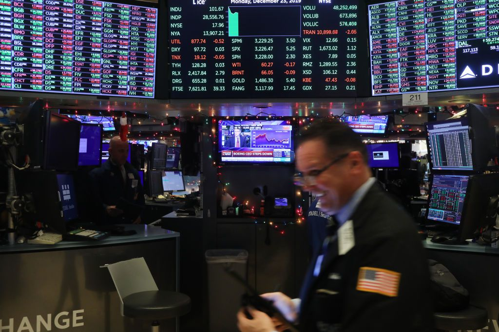 Trading floor of the New York Stock Exchange showing market data active during trading hours