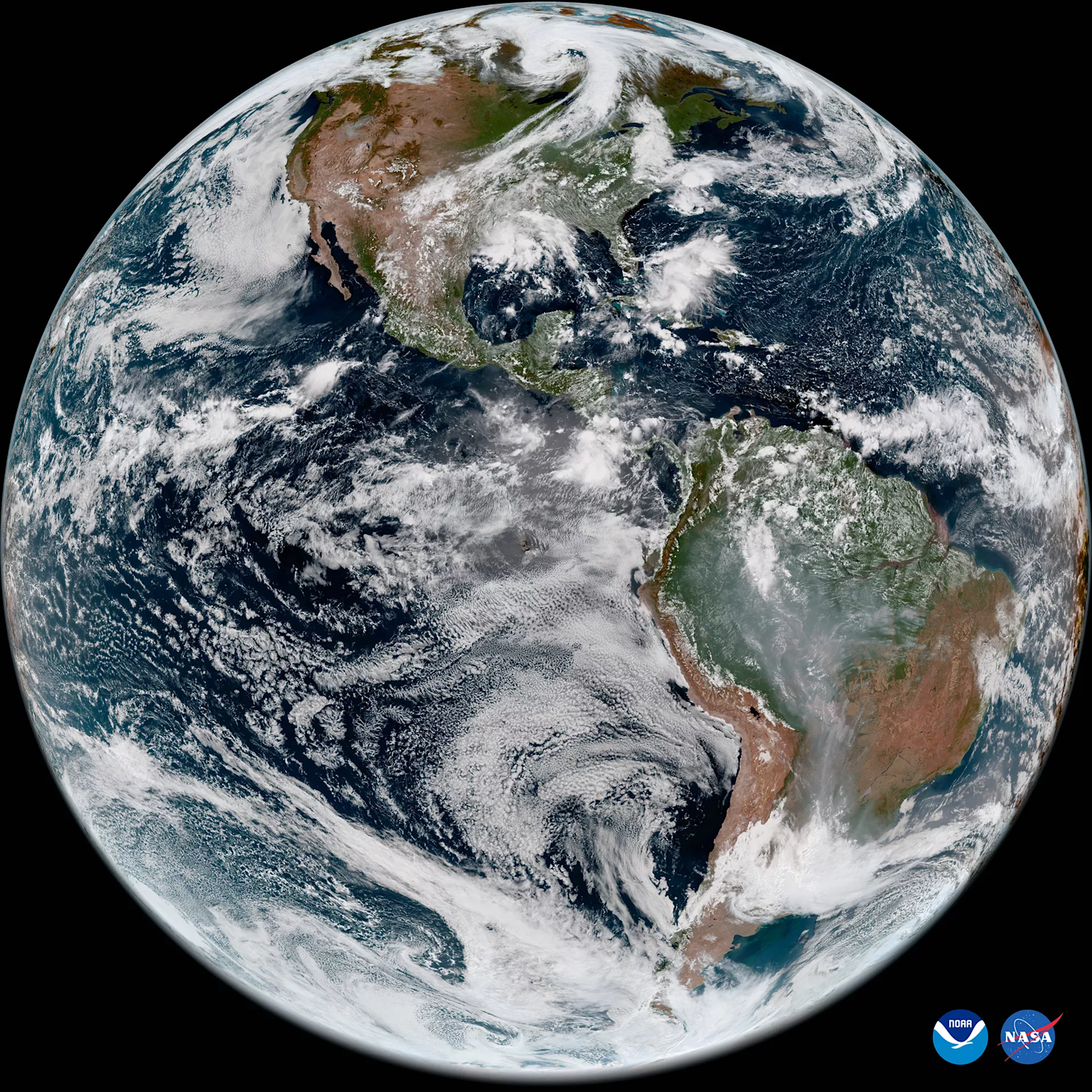 Satellite image showing weather patterns over the Americas from NOAA and NASA satellites