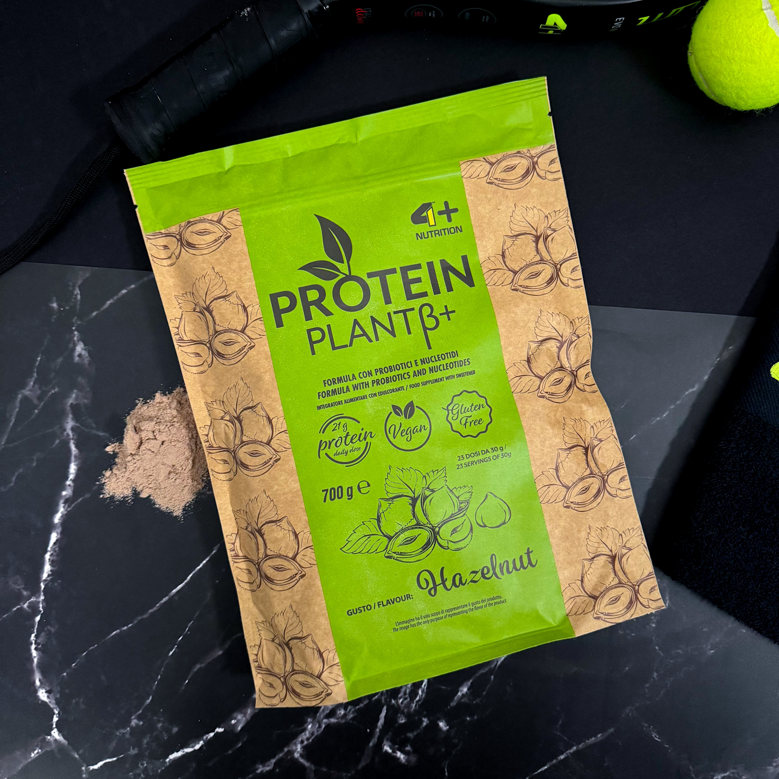 Package of vegan, gluten-free hazelnut-flavored plant protein powder with probiotics and 21g protein per dose