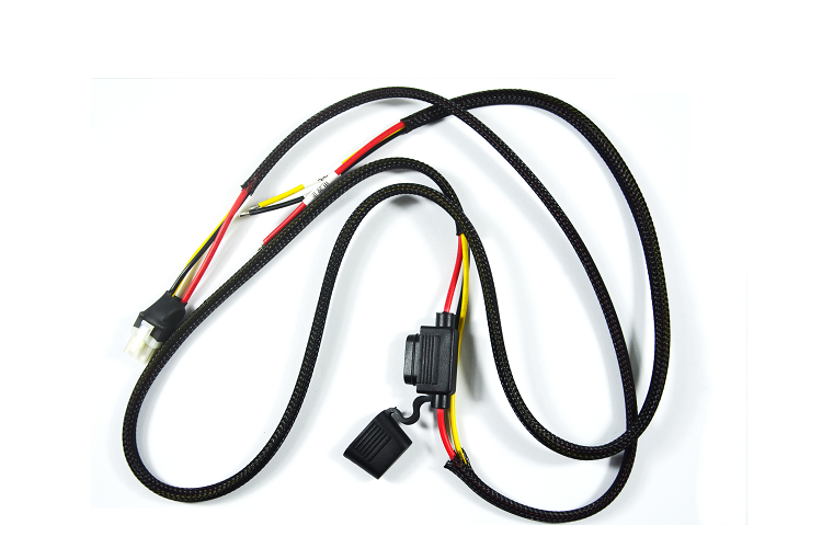 An automotive wiring harness with protective sleeving and connectors displayed against a white background