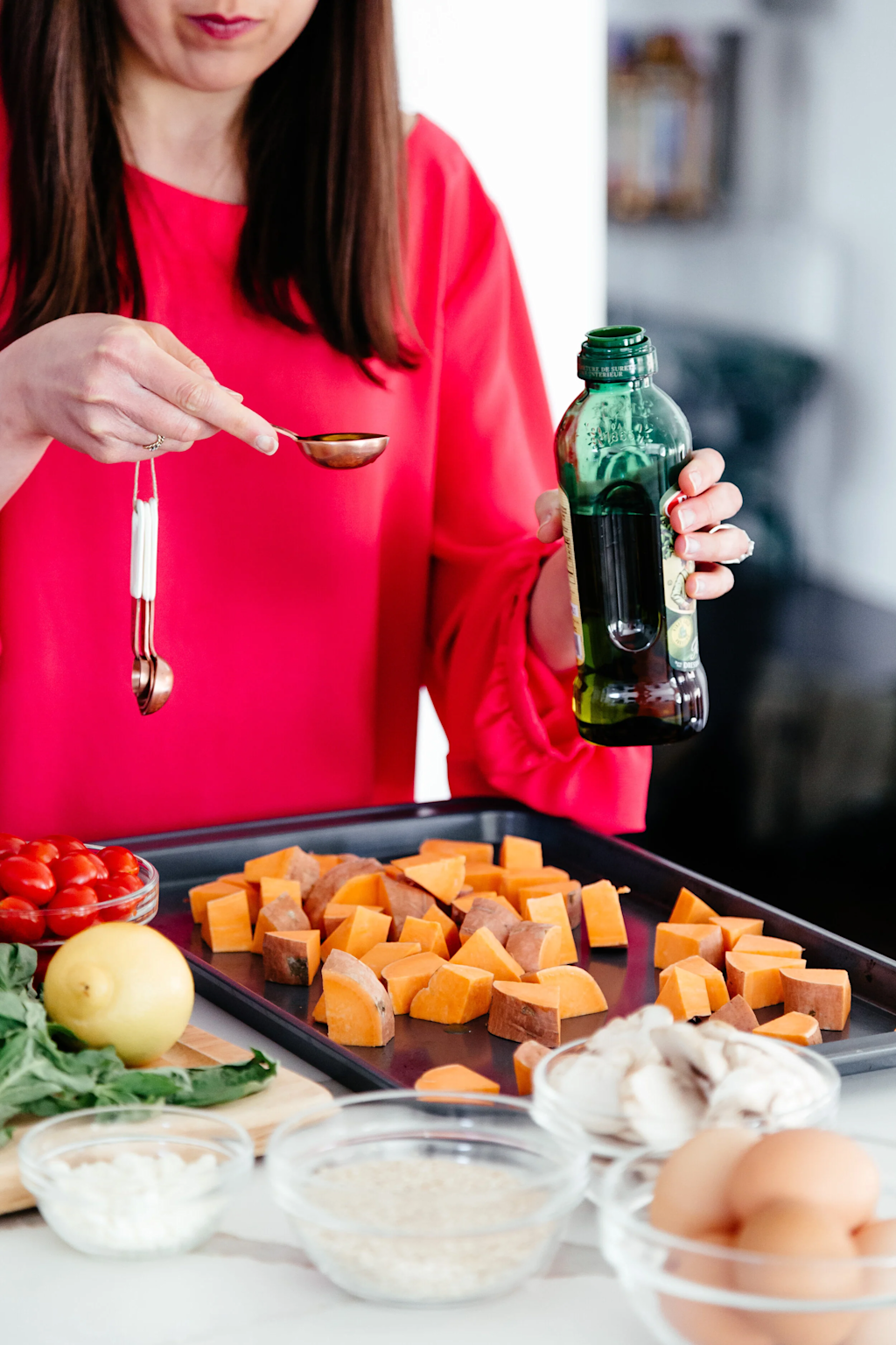 Preparing a healthy meal with sweet potatoes and fresh ingredients for active teens' sports nutrition