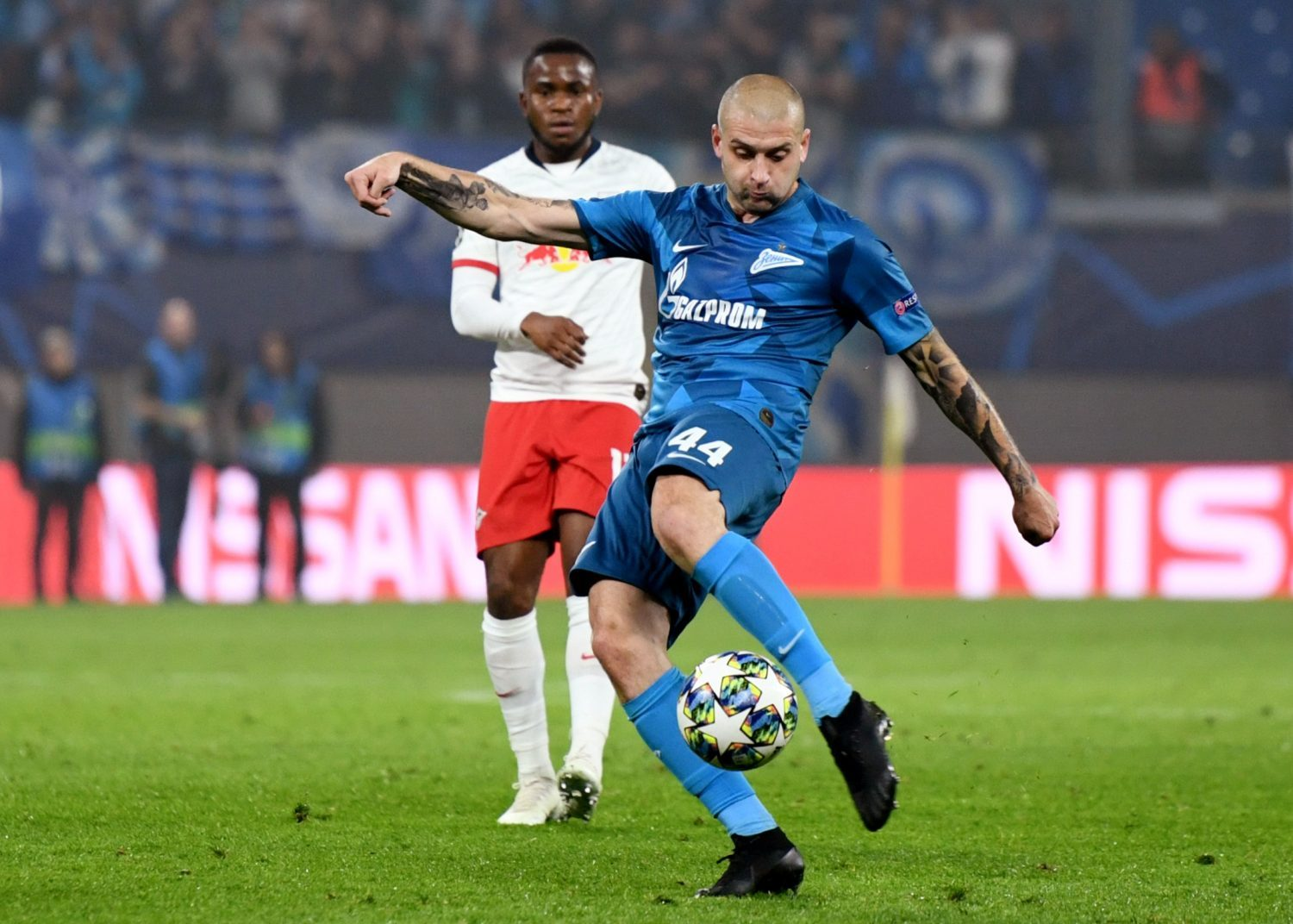 A Zenit Saint Petersburg football player prepares to kick the ball during a professional match against RB Leipzig