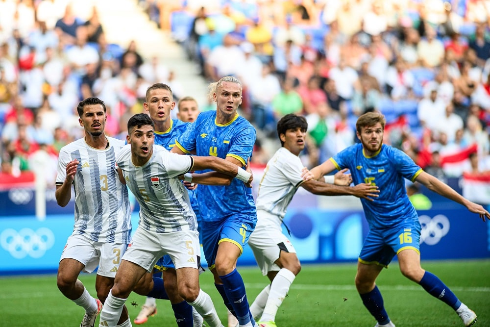Ukrainian football players competing in an international soccer match during the Olympics