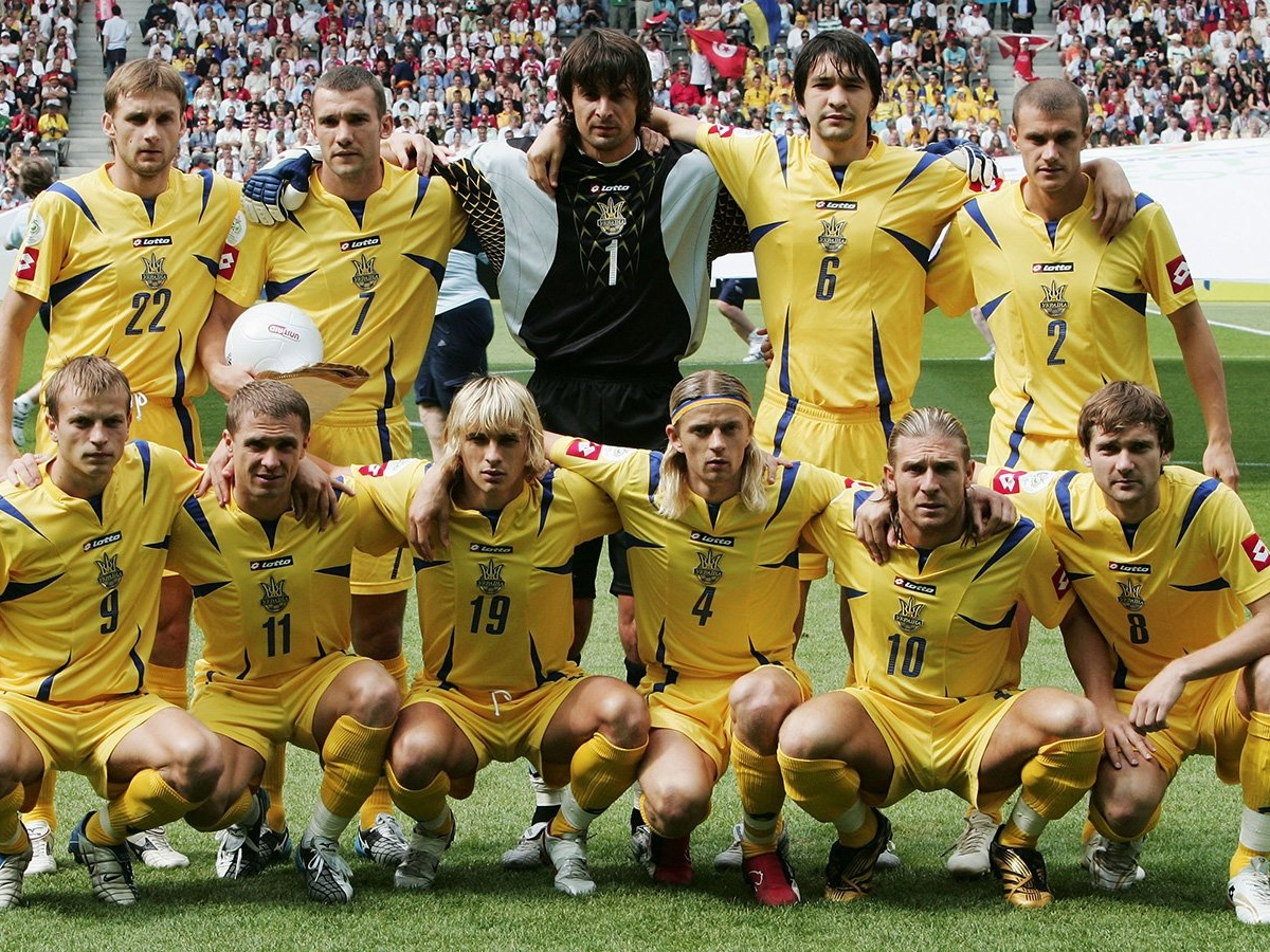 Ukrainian national football team posing in yellow uniforms before a match, representing notable Ukrainian soccer champions