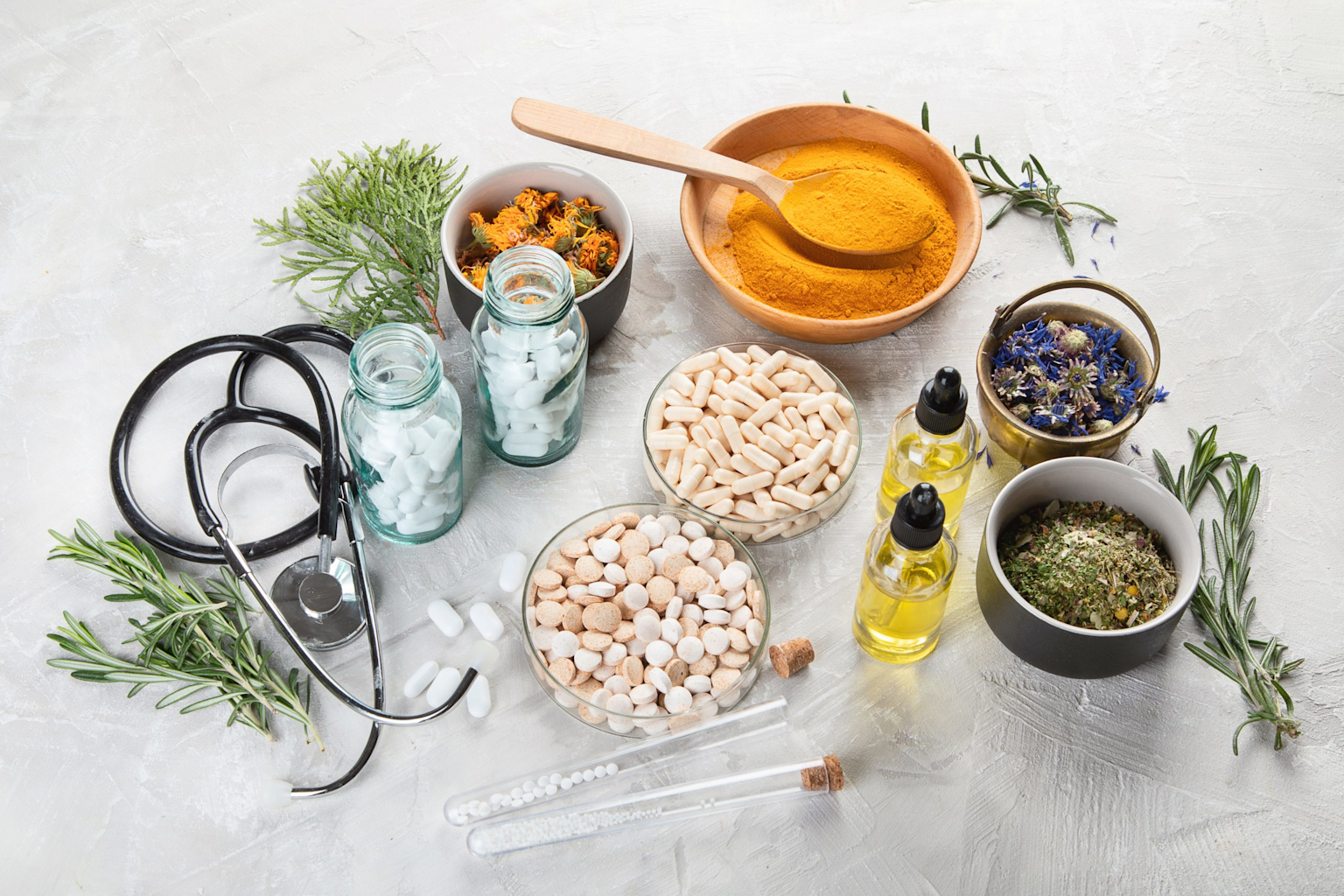 Holistic natural medicine setup with herbal remedies, supplements, and a stethoscope illustrating integrative health care