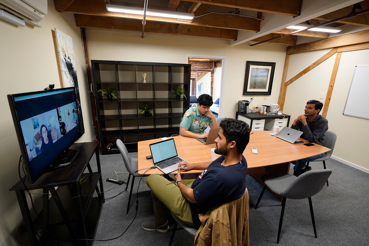 Modern Silicon Valley office with in-person and remote team collaboration