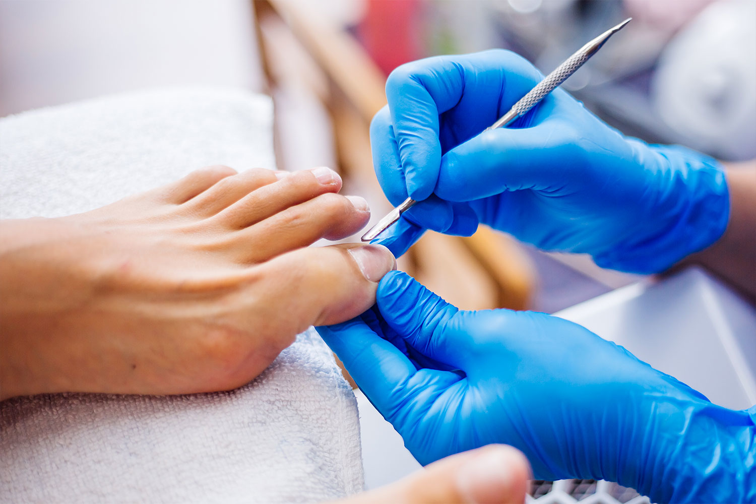 Professional foot care with medical pedicure tools and gloves to maintain nail hygiene and health