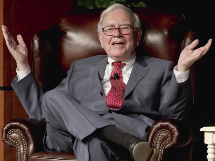 Warren Buffett, the legendary investor, pictured seated in a suit, embodying his well-known status as an investment icon