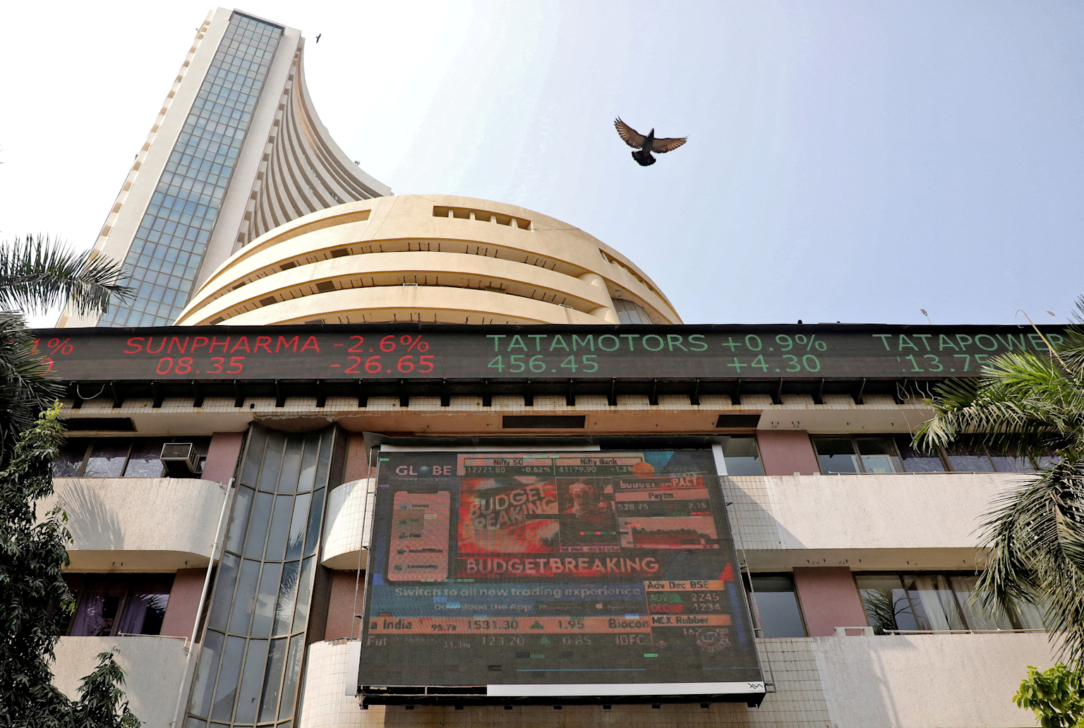 Bombay Stock Exchange building with live stock ticker showing market performance in Mumbai, India