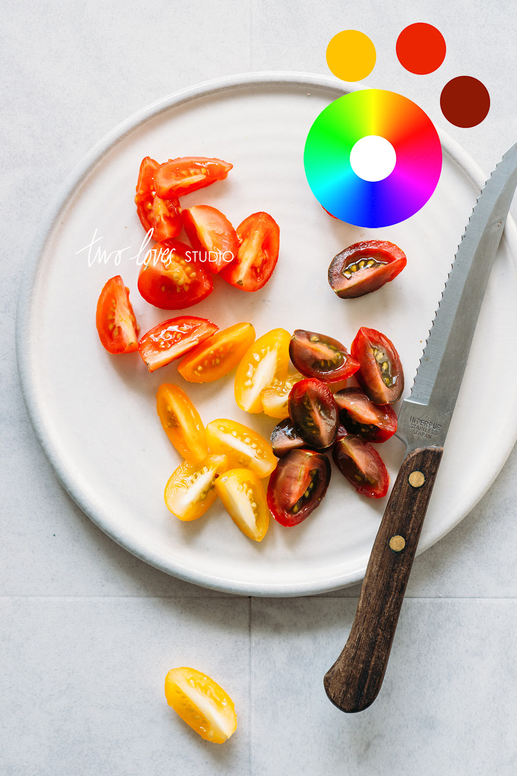 Cherry tomatoes of different colors arranged on a plate showcasing color contrast in food photography composition.