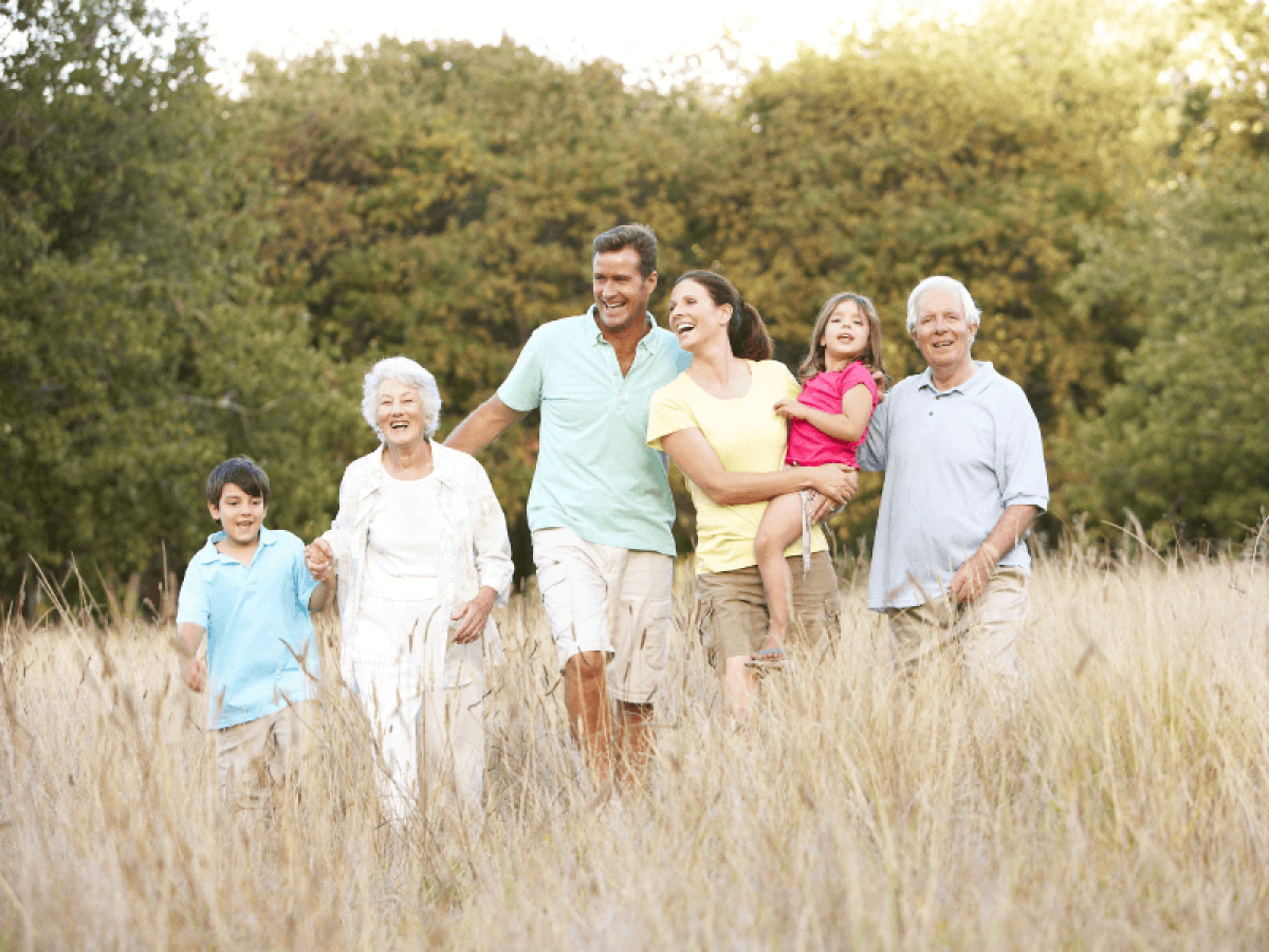 Multi-generational family enjoying outdoor activity, symbolizing health and wellness across ages