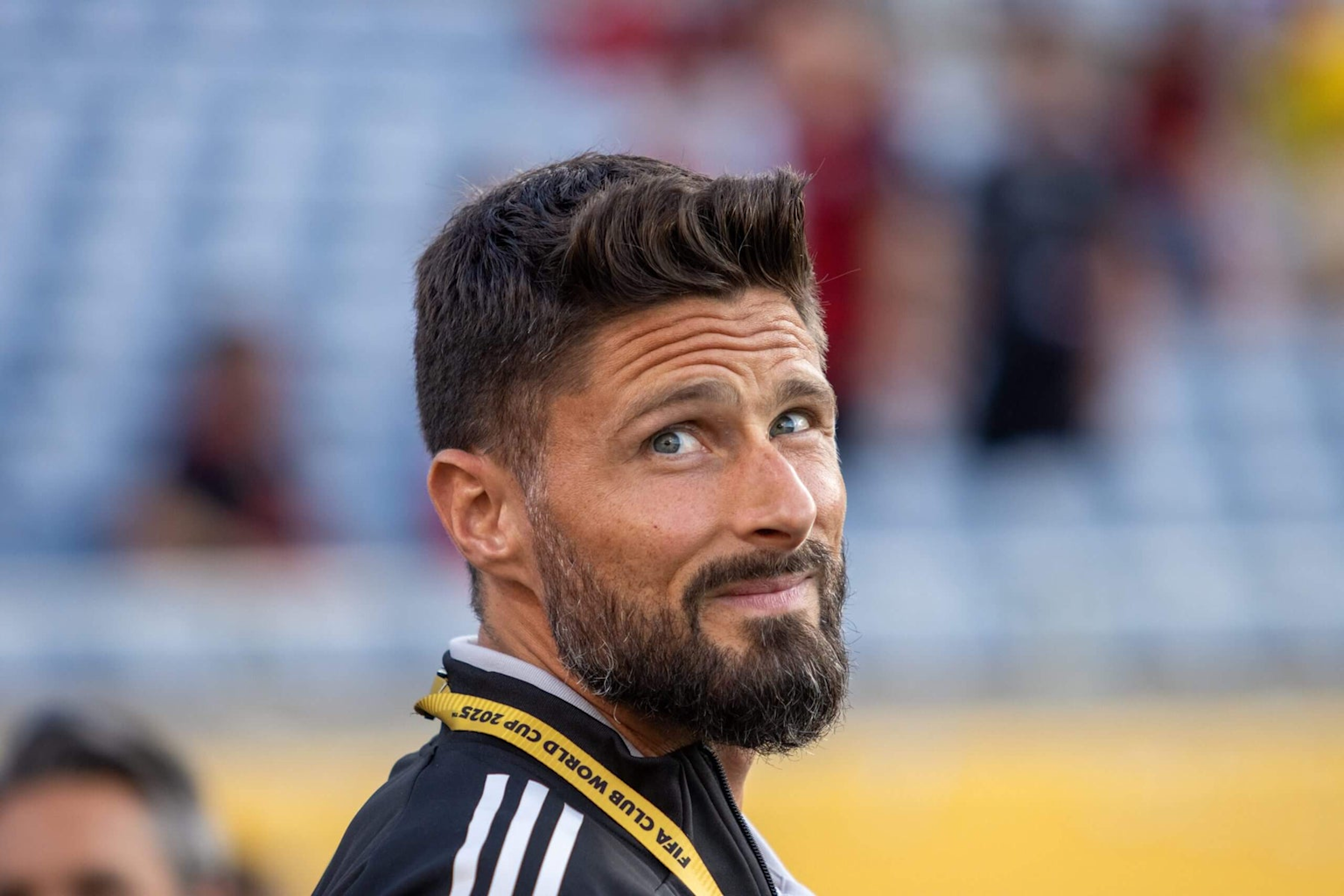 Olivier Giroud, French striker, wearing a FIFA Club World Cup lanyard at a stadium event