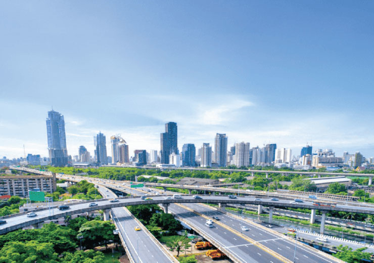 Modern urban infrastructure and skyline of Hyderabad featuring expansive highways and high-rise buildings