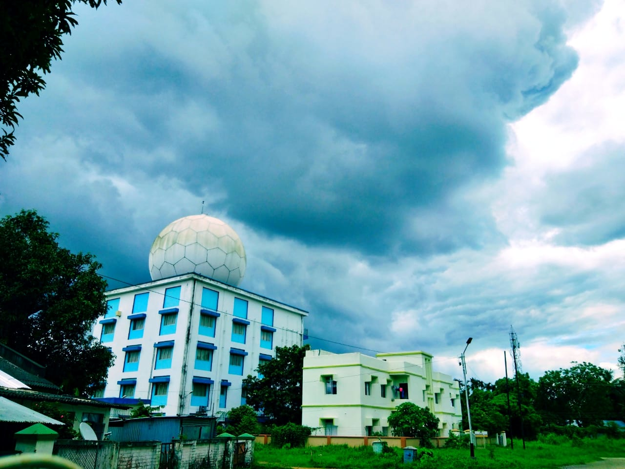 India Meteorological Department radar station building with its distinctive radome under a cloudy sky