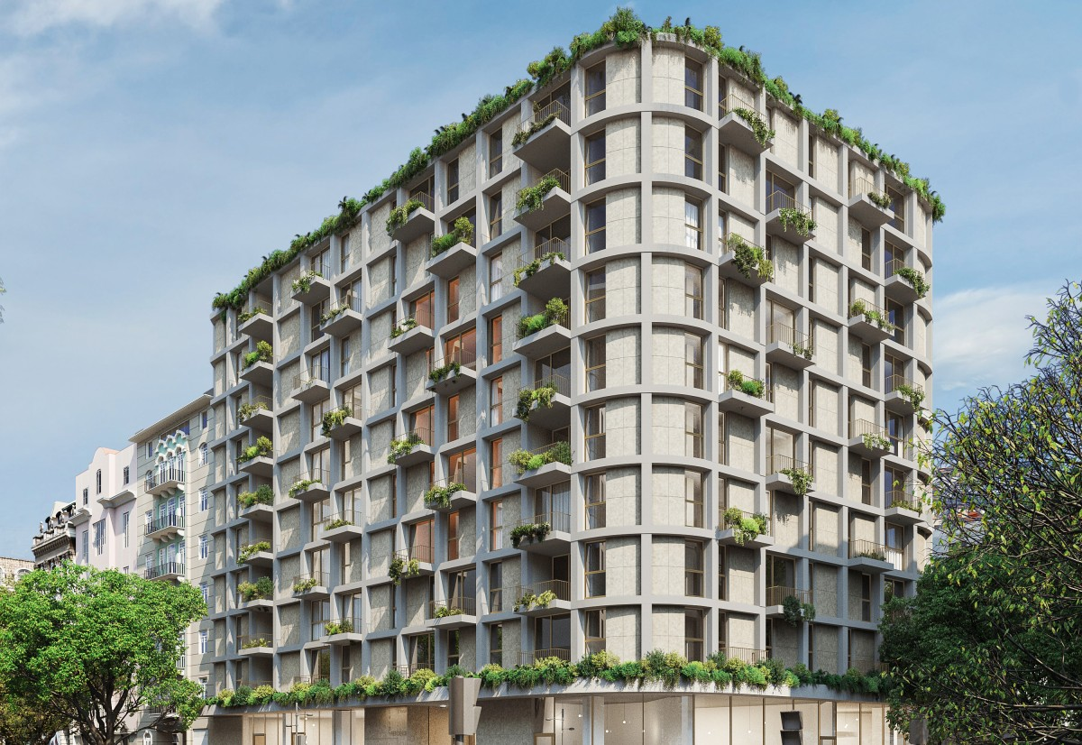 A modern residential building in Lisbon with green balconies and rooftop gardens highlighting sustainable urban living