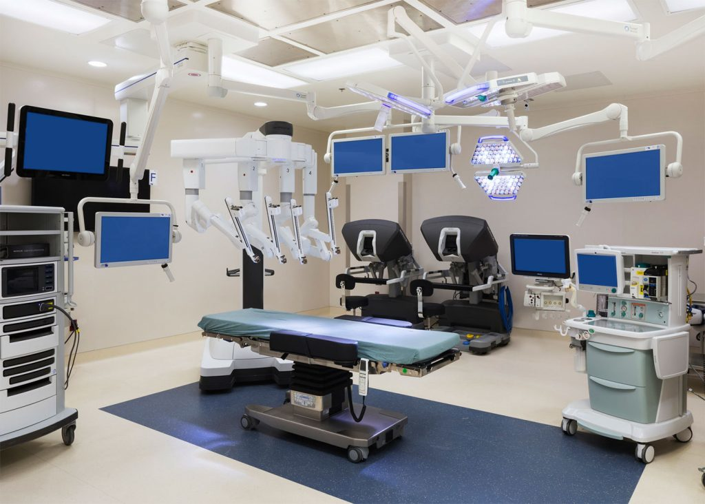 Modern cardiac care unit equipped with advanced robotic surgical systems and multiple monitors