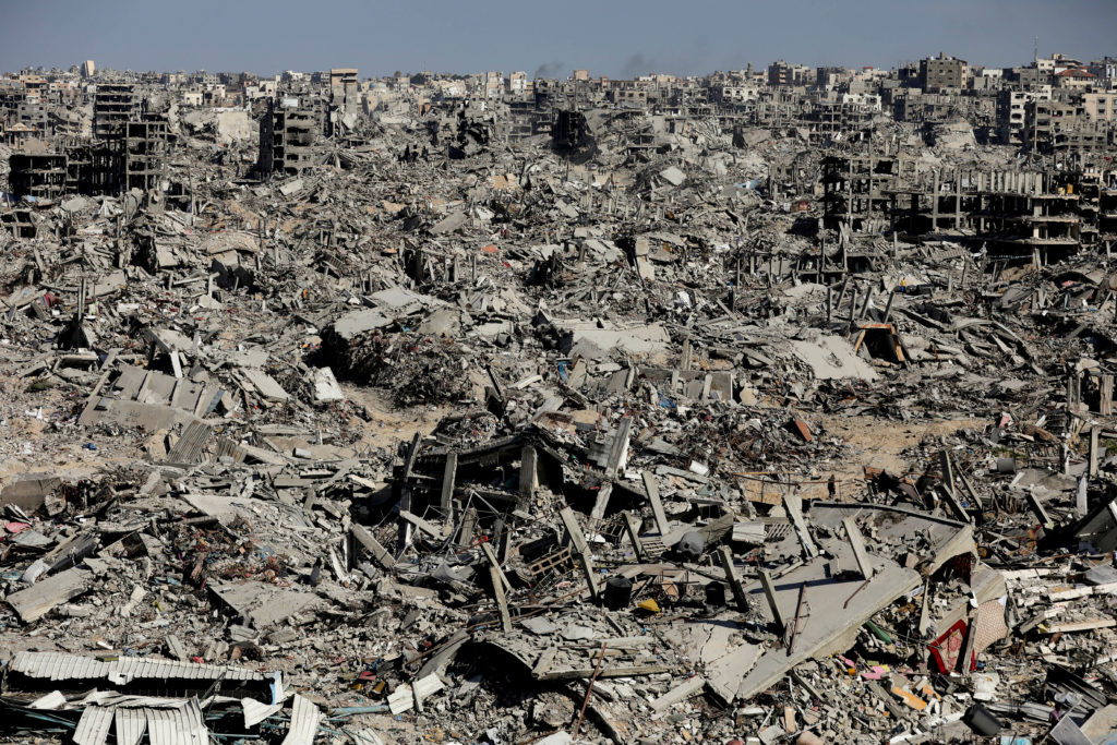 Extensive urban destruction and rubble in Gaza, showing widespread devastation of buildings and infrastructure