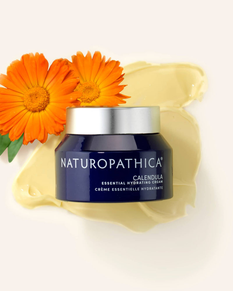 Naturopathica calendula essential hydrating cream with calendula flowers and cream smear