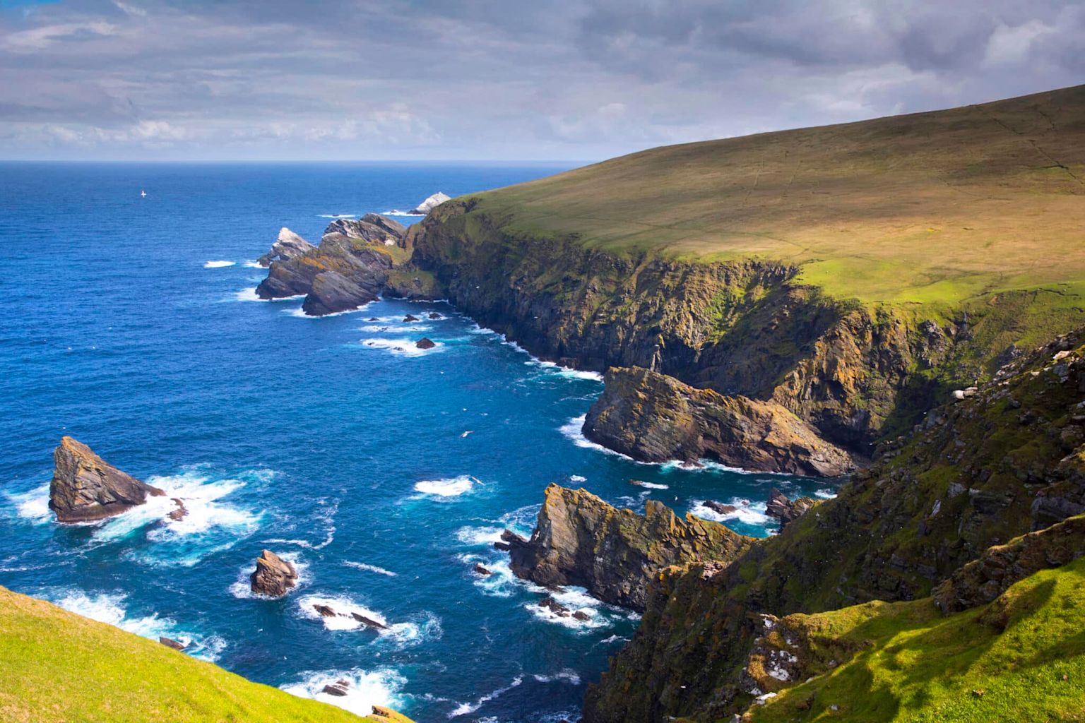 Hermaness National Nature Reserve on Unst in the Shetland Islands showcases rugged cliffs and wild ocean views ideal for adventurous nature travelers