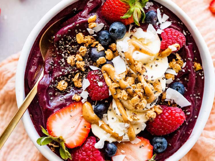 Authentic açaí bowls topped with fresh tropical fruits