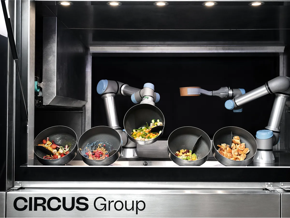 Autonomous robotic arms from Circus Group preparing food in a fully automated kitchen system