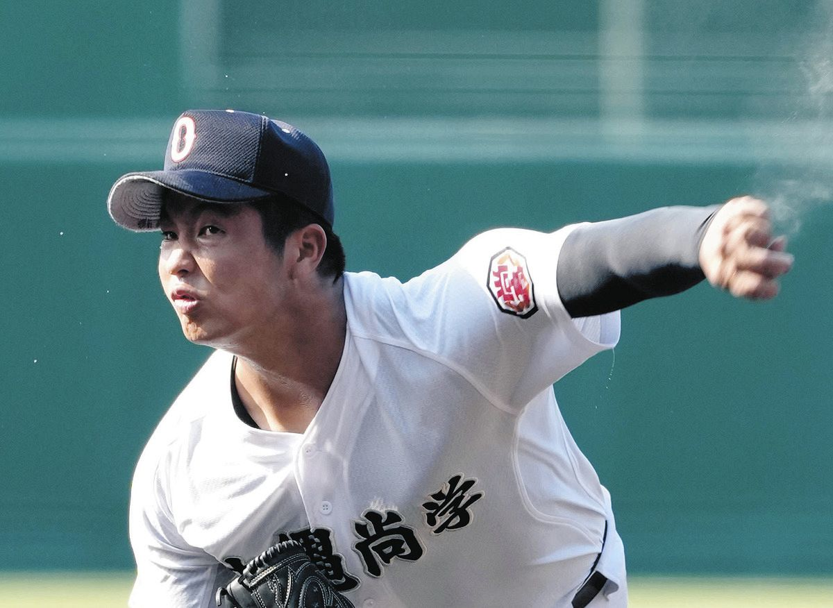 A pitcher from Okinawa Shogaku High School delivering a pitch during a game, highlighting their strong pitching lineup at the 2025 Koshien tournament