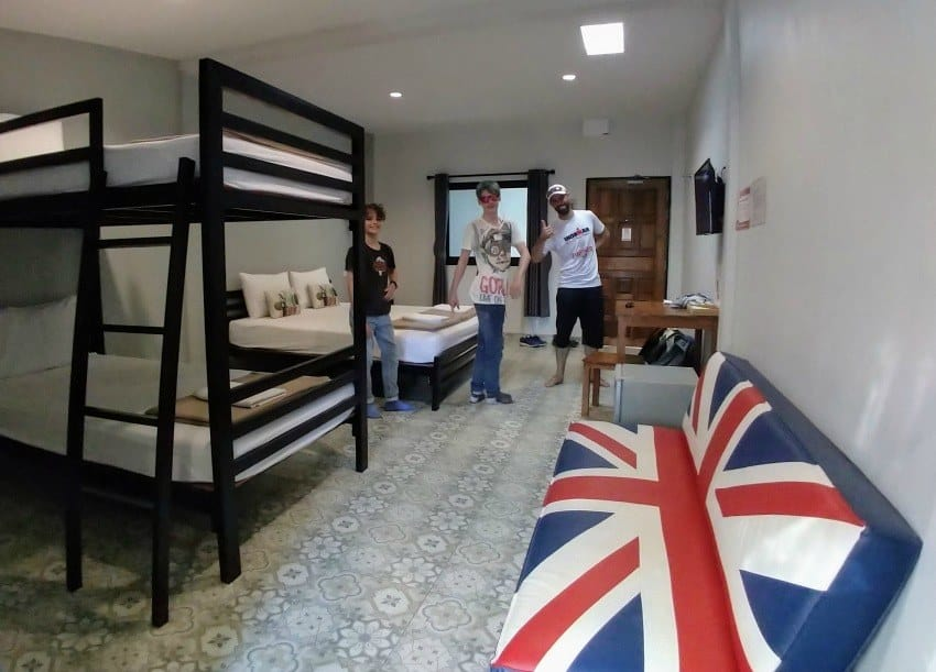 Budget-friendly Southeast Asia hostel dorm room with bunk beds and shared living space for backpackers