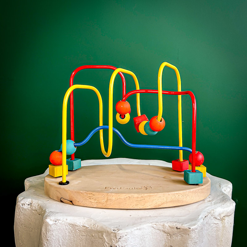 Colorful bead maze toy photographed with clean background and even lighting for professional quality.