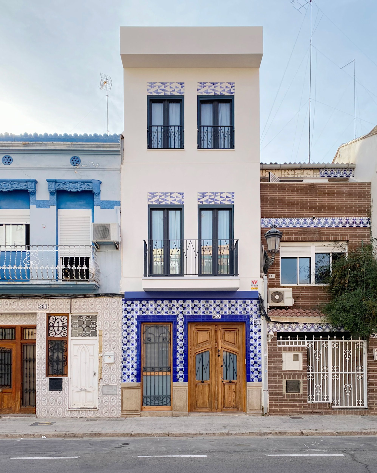 A Colorful Traditional House Facade With Blue And White Tiles In El Cabanyal, Valencia, Exemplifying The Neighborhood'S Modernist Charm