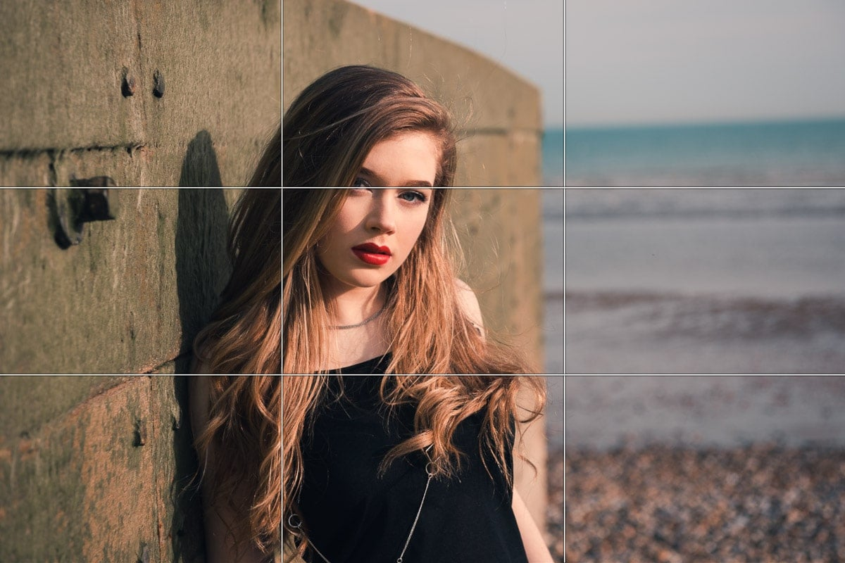 A beach portrait illustrating the rule of thirds grid to enhance photo composition