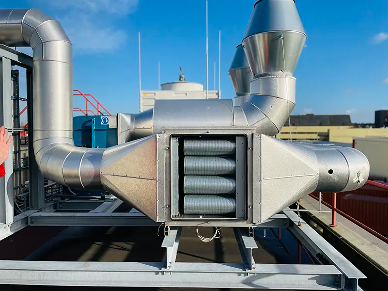 Industrial odour control system featuring metallic ducts and filters for managing air emissions from industrial processes