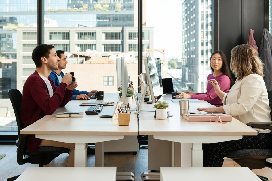 Small business team collaborating in a modern office workspace, exemplifying productivity and teamwork
