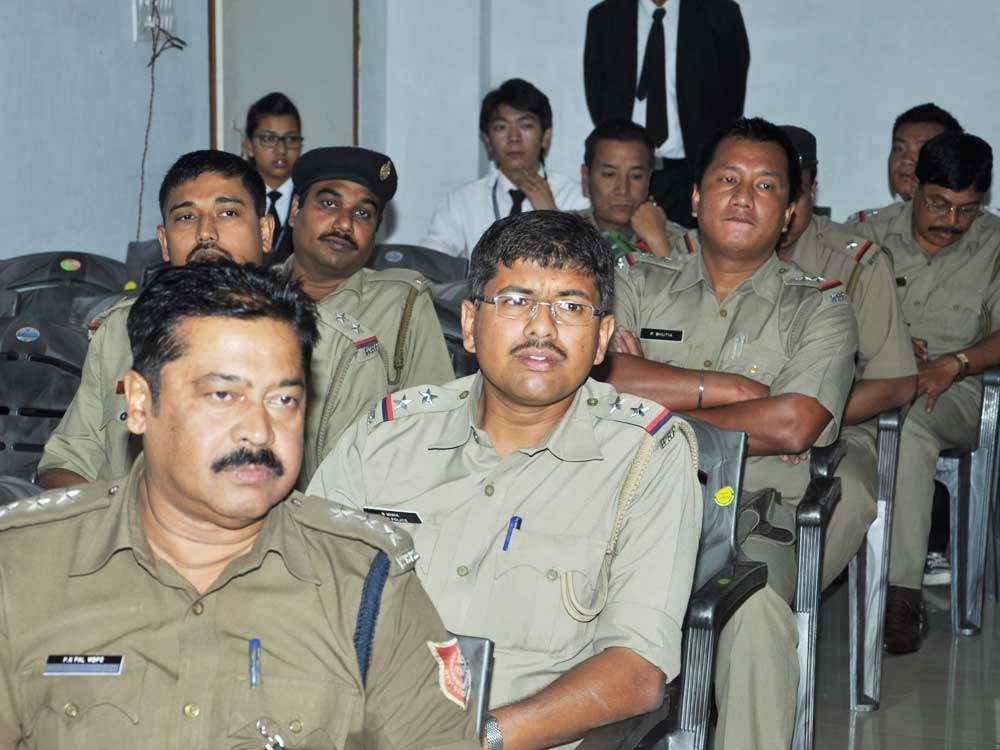 Police officers attending a workshop likely focused on human rights training in India