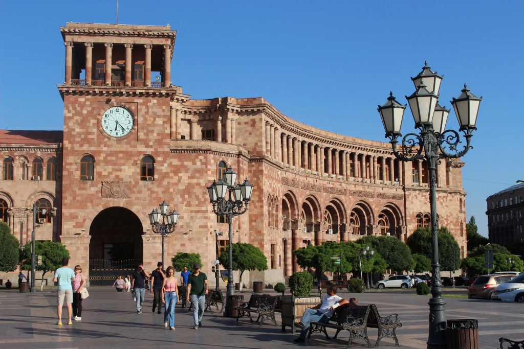 Republic Square in Yerevan, Armenia, showcasing its iconic pink stone architecture and vibrant public space under clear skies