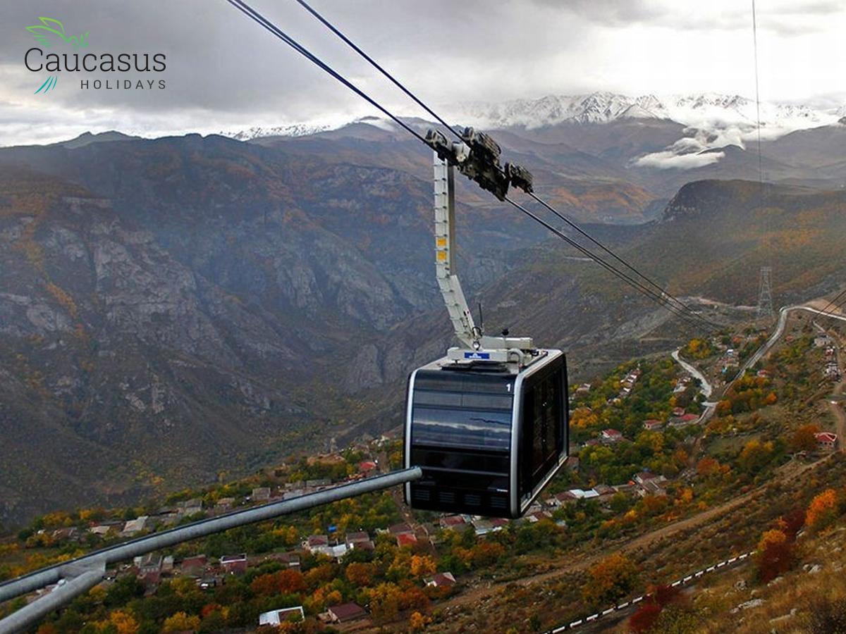 The Wings of Tatev cable car offers stunning aerial views over Armenia's mountainous landscapes and village below
