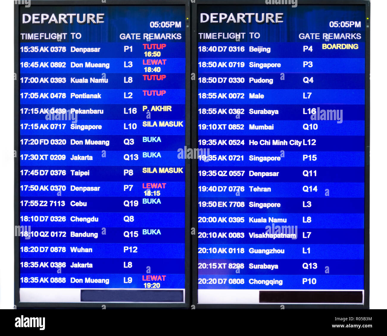 International airport departure boards showing flight times, gates, and boarding statuses for various global destinations