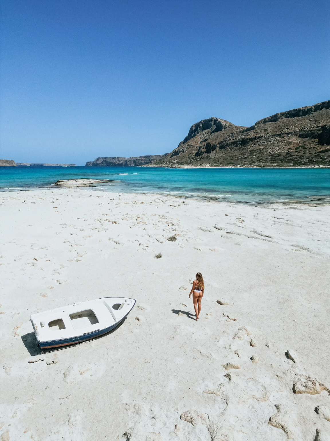 Serene Balos Lagoon beach on Crete invites solo travelers with its turquoise waters and peaceful sandy shores