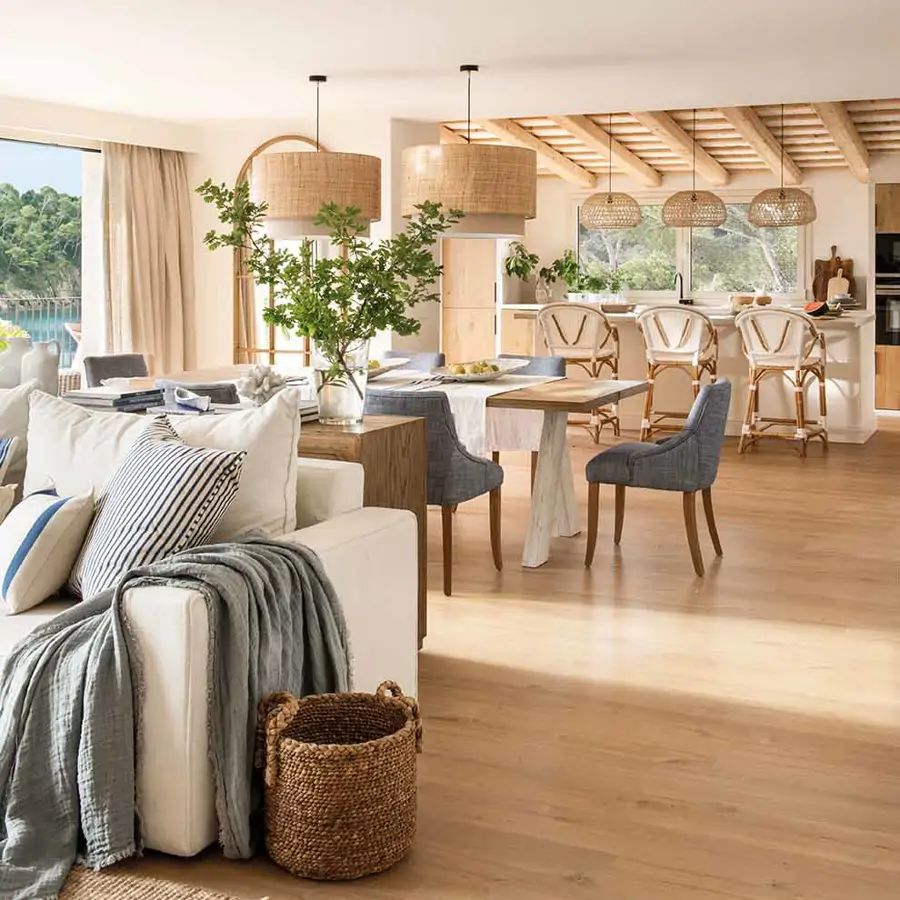 Use furniture like sofas and dining sets to naturally separate living, dining, and kitchen areas without any construction work