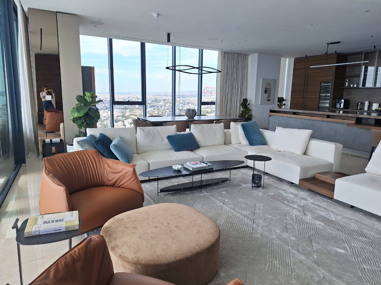 Spacious and modern living room interior of a luxury apartment with panoramic city views on the Mediterranean coast