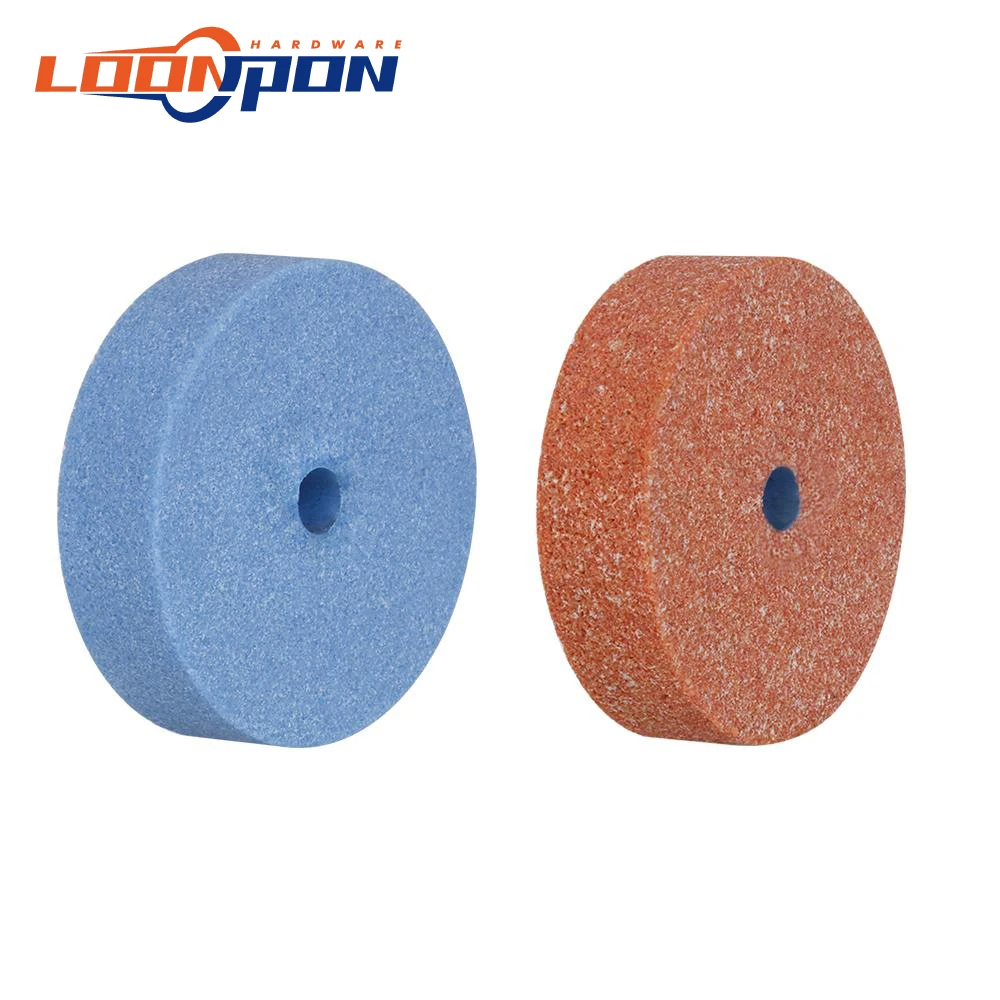 Two ceramic grinding wheels in blue and orange with central mounting holes, displayed against a white background