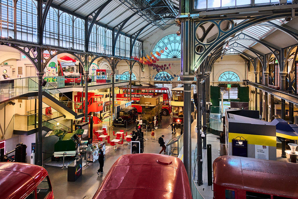 Interior view of the London Transport Museum showcasing historic vehicles.