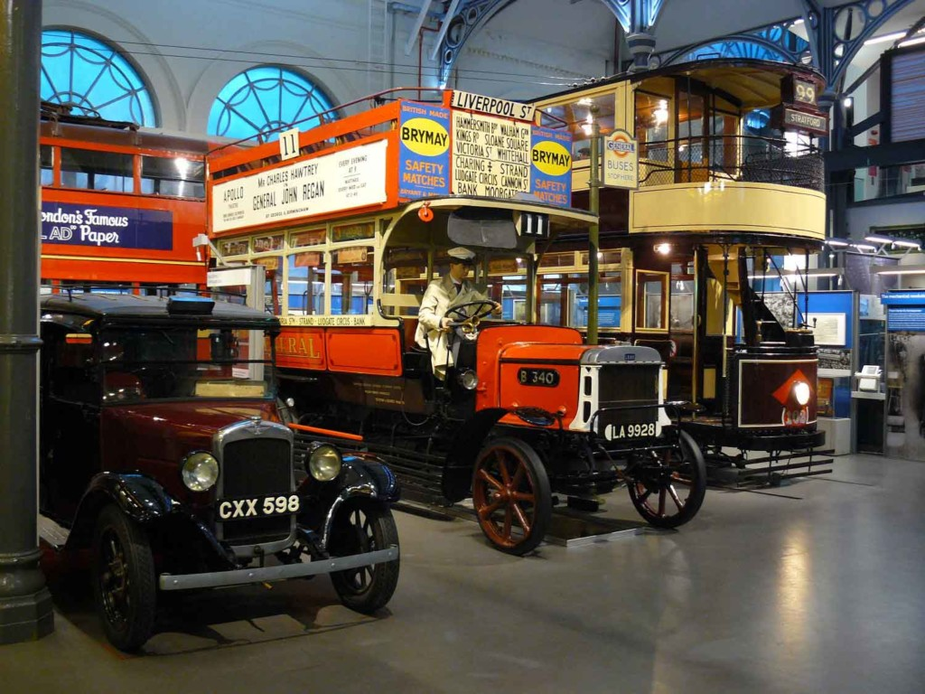 Vintage London buses and an early automobile at the London Transport Museum.