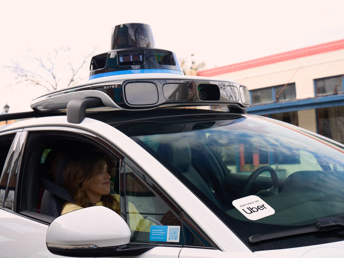 A Waymo autonomous vehicle integrated with Uber's platform, showcasing self-driving technology for robotaxi services