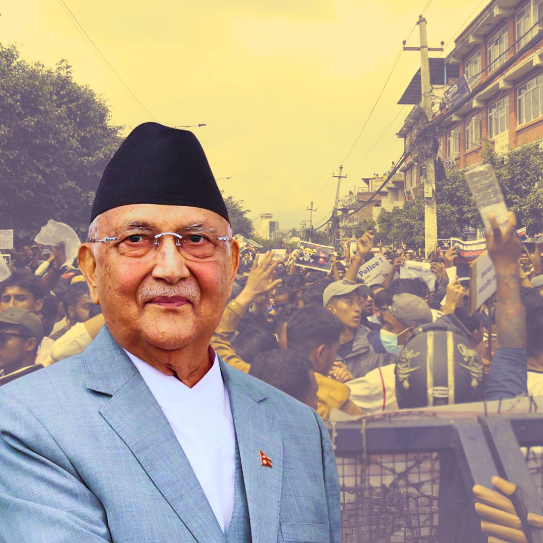 Nepal Prime Minister KP Sharma Oli with protestors demonstrating in the background amid political unrest