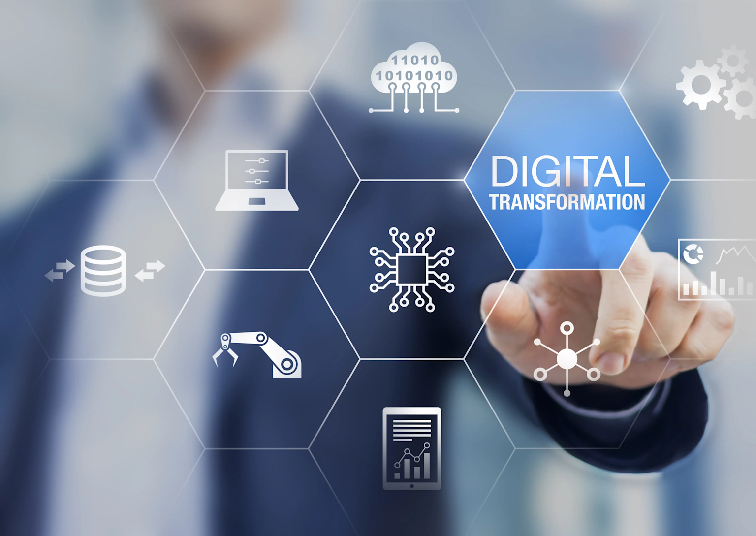 A business professional interacts with a digital interface highlighting digital transformation and related technology concepts