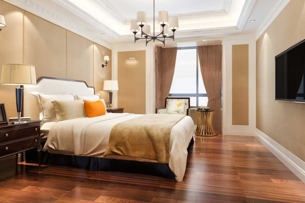 Elegant bedroom with wooden bed and warm decor illustrating Vastu-compliant furniture placement