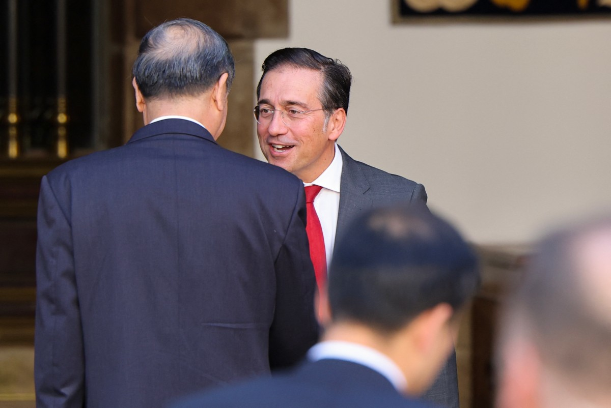 Diplomats in formal attire engaged in negotiations at a highlevel international meeting in Madrid
