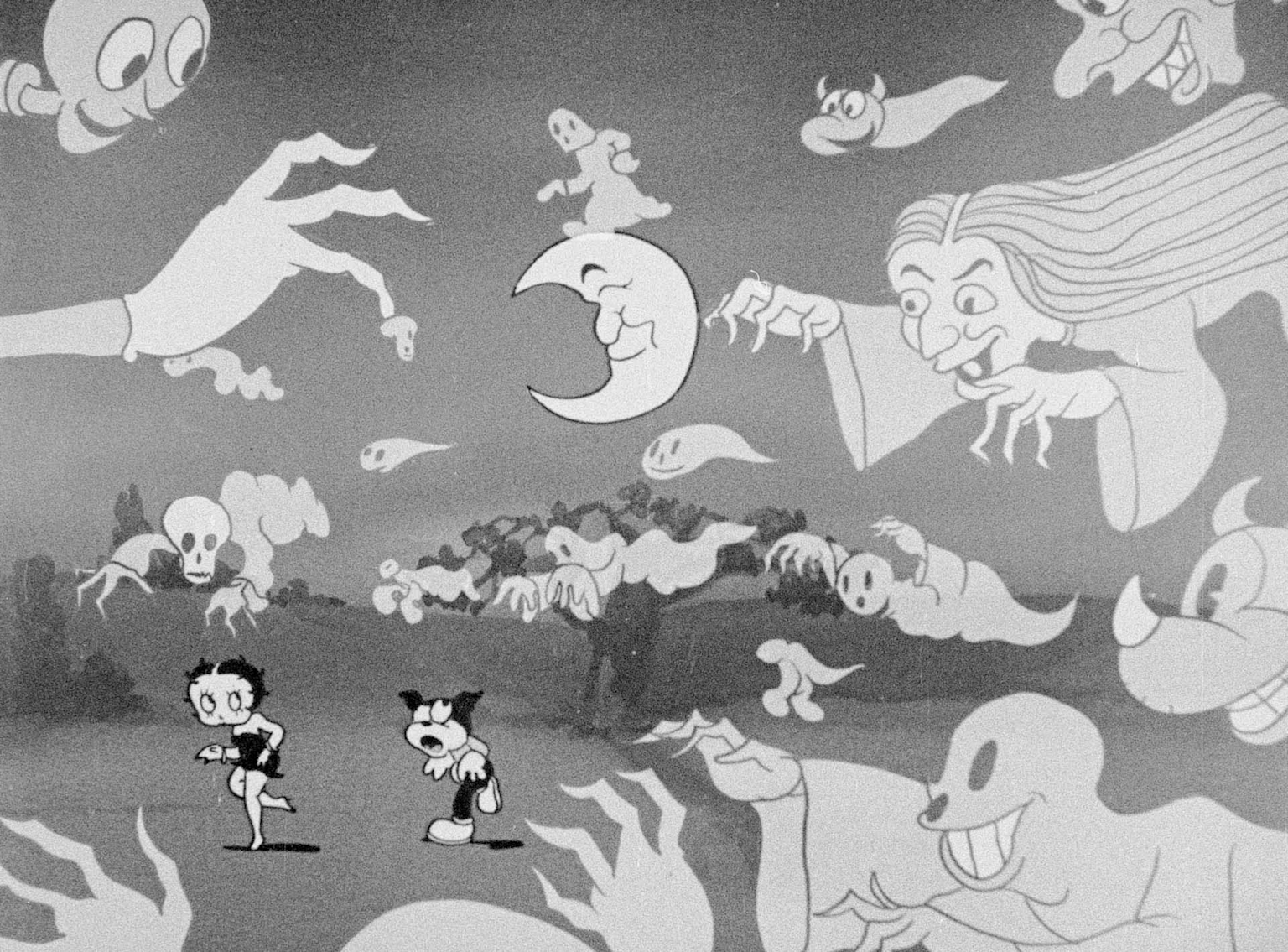Black and white frame from a Fleischer Studios Betty Boop cartoon depicting Betty and her dog surrounded by playful ghosts and monsters, reflecting the studio's urban and surreal animation style of the early 1930s