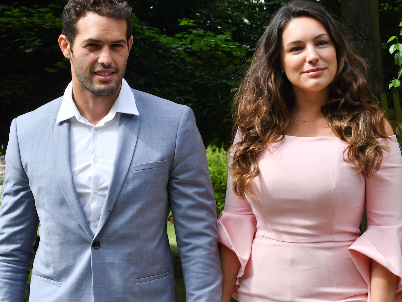 Kelly Brook and Jeremy Parisi at a formal outdoor event, possibly related to their 2022 wedding in Italy