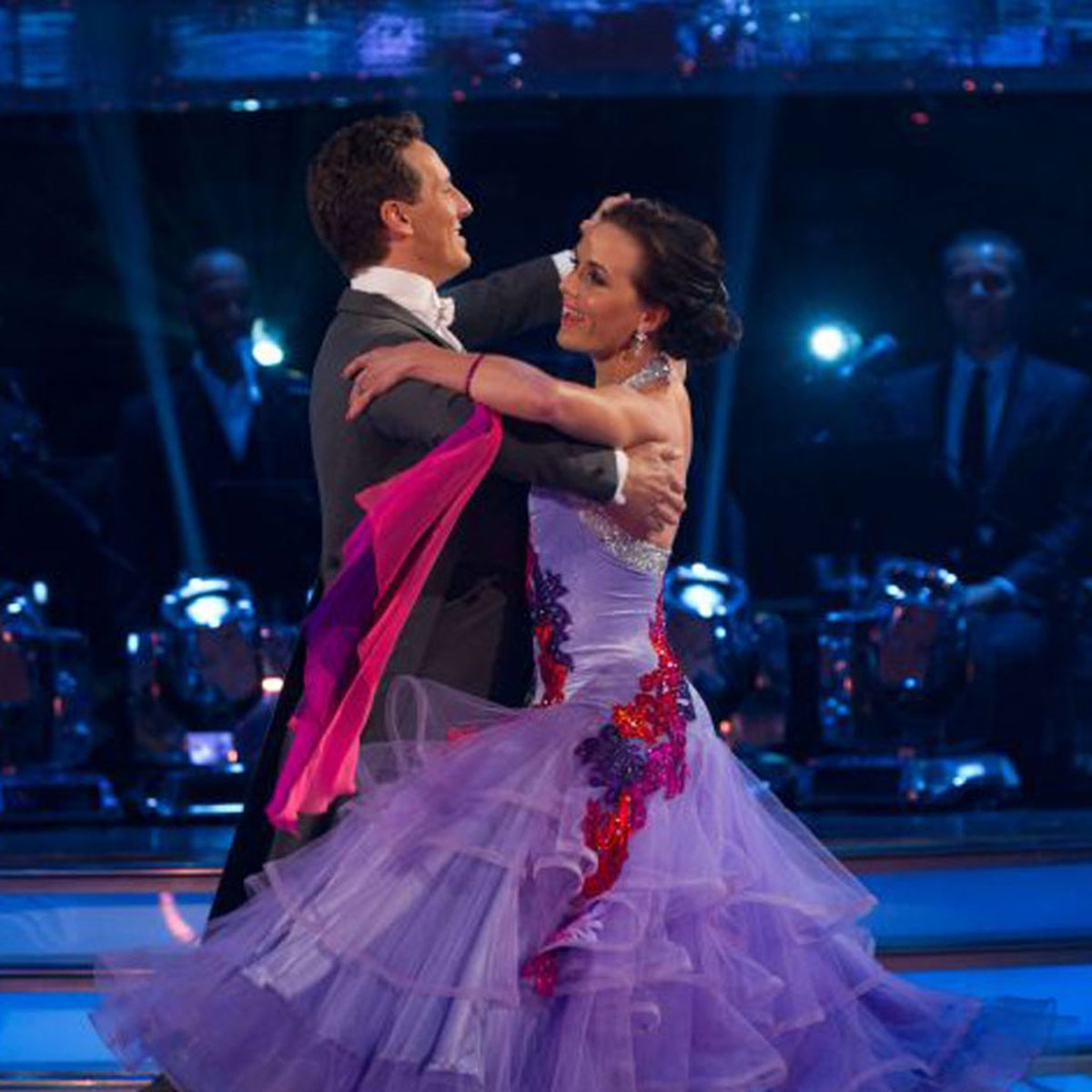 Brendan Cole and dance partner performing on Strictly Come Dancing in a ballroom setting